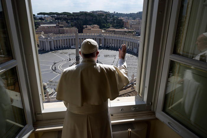 epa08295459 A handout picture provided by the Vatican Media shows Pope Francis looks out the window on empty St Peter's Square during Angelus prayer at the Vatican, 15 March 2020. Due to the Covid-19 coronavirus outbreak, Pope Francis celebrated the prayer without audience, which is transmitted via TV.  EPA/VATICAN MEDIA HANDOUT  HANDOUT EDITORIAL USE ONLY/NO SALES