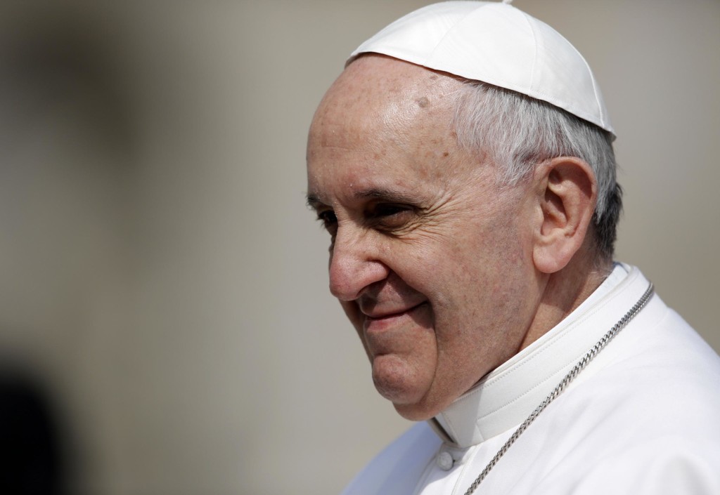 Pope Francis is driven through the crowd during his general audience, in St. Peter's Square, at the Vatican, Wednesday, March 27, 2013. (AP Photo/Andrew Medichini)